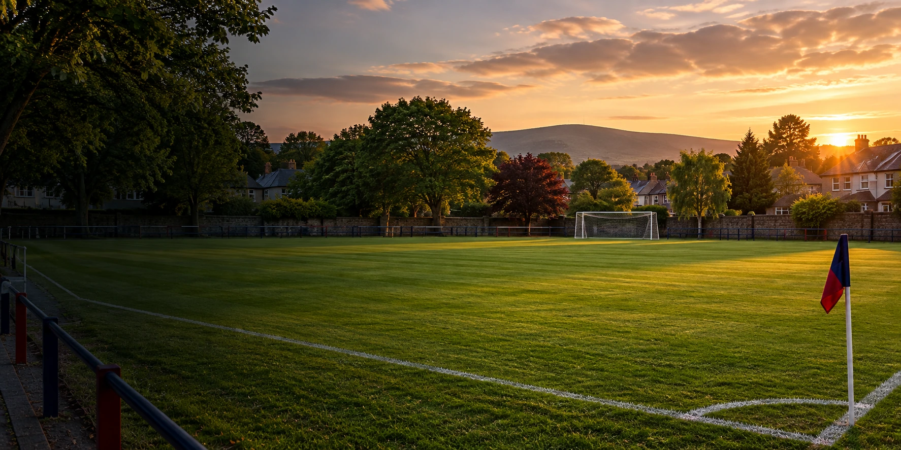 Rosemount Mulvey FC crest over a Dundrum football pitch at Rosemount Park
