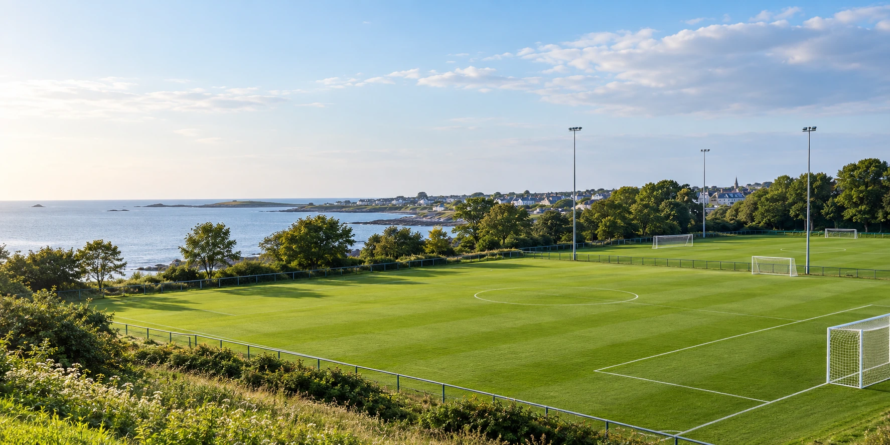 Skerries Town FC crest over football pitches beside the Skerries coast