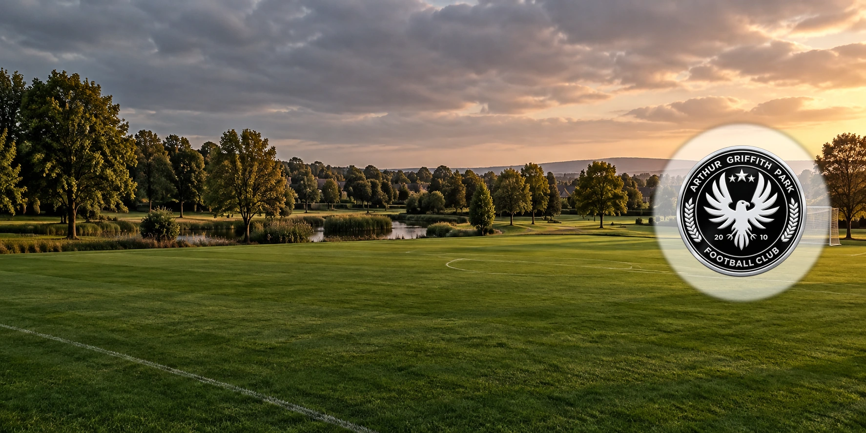 Arthur Griffith Park FC crest over a Lucan football ground and park landscape